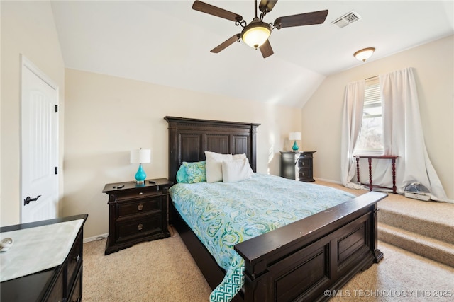 carpeted bedroom featuring ceiling fan and vaulted ceiling