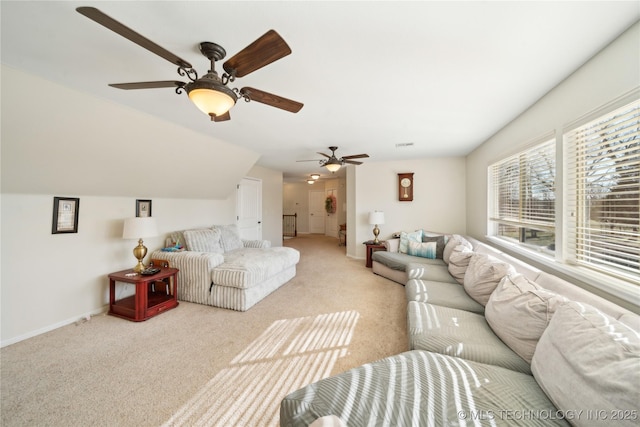 carpeted living room with ceiling fan