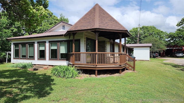 rear view of house with a lawn