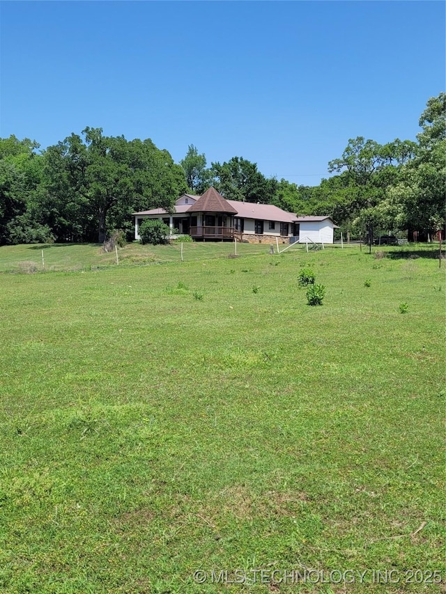 view of yard with a rural view