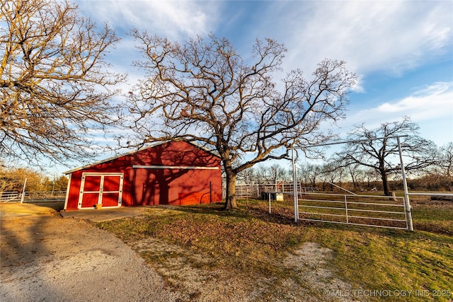 view of stable featuring a rural view