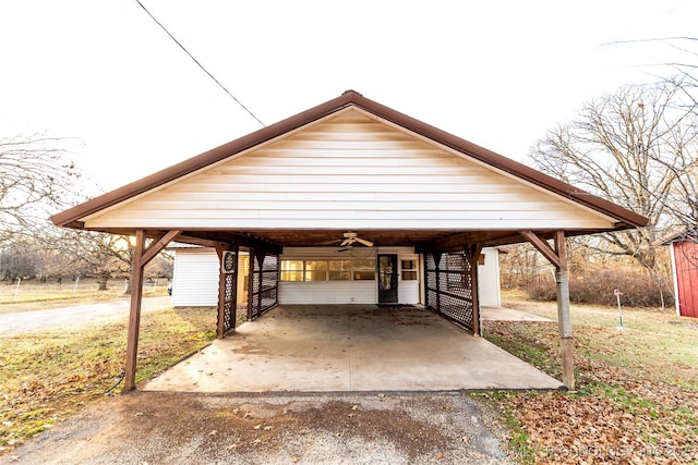 view of front of home featuring a carport and ceiling fan