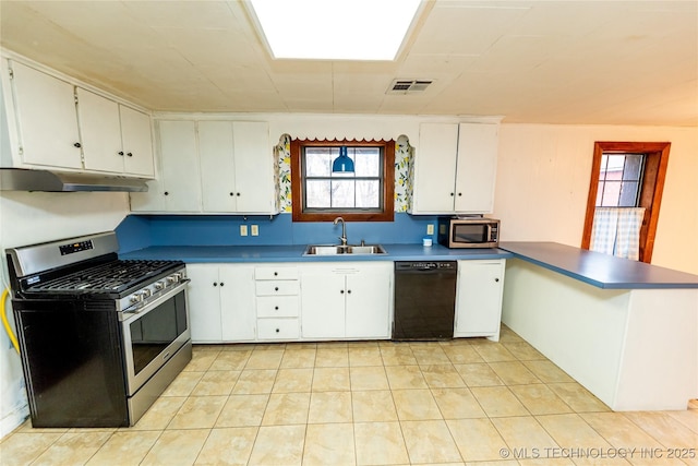 kitchen featuring kitchen peninsula, white cabinetry, sink, and stainless steel appliances