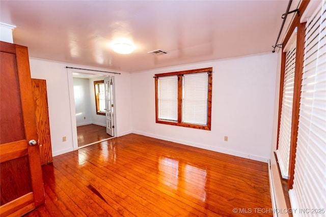 unfurnished bedroom with wood-type flooring