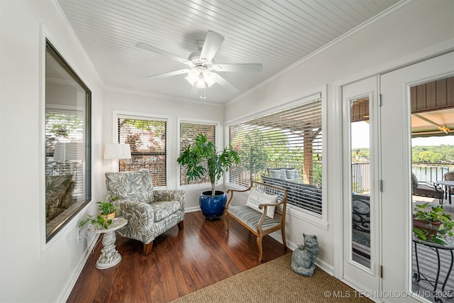 sunroom featuring ceiling fan