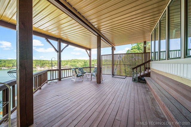 wooden terrace with a water view