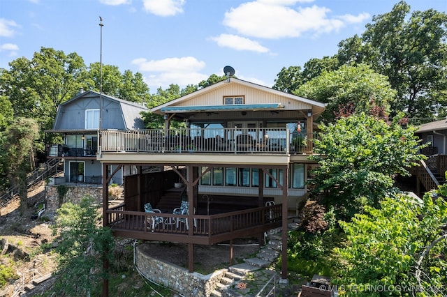 back of property featuring a deck