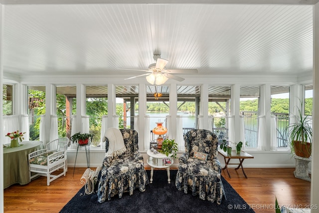 sunroom with ceiling fan and plenty of natural light