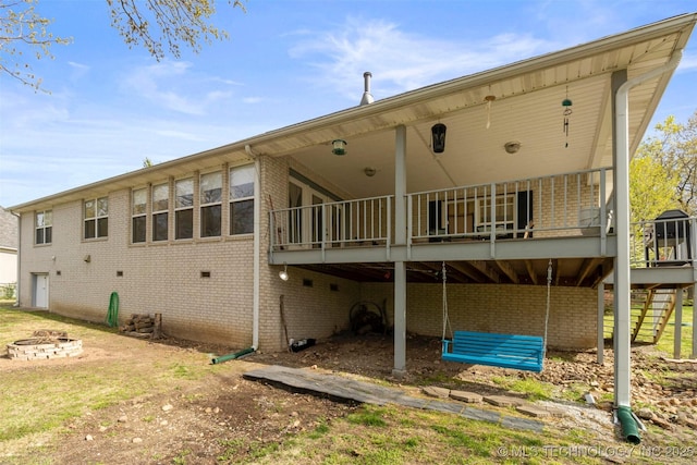 rear view of house with a fire pit