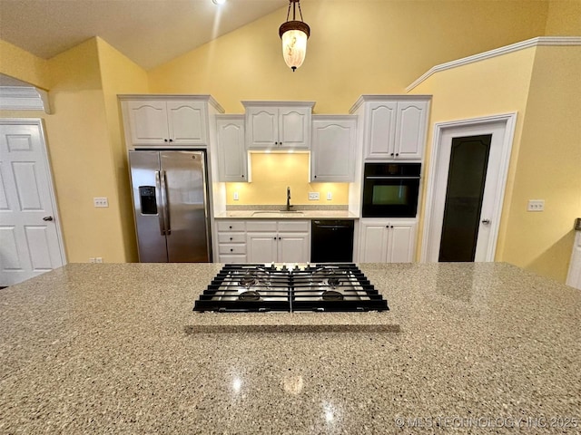 kitchen featuring black appliances, sink, vaulted ceiling, light stone countertops, and white cabinetry