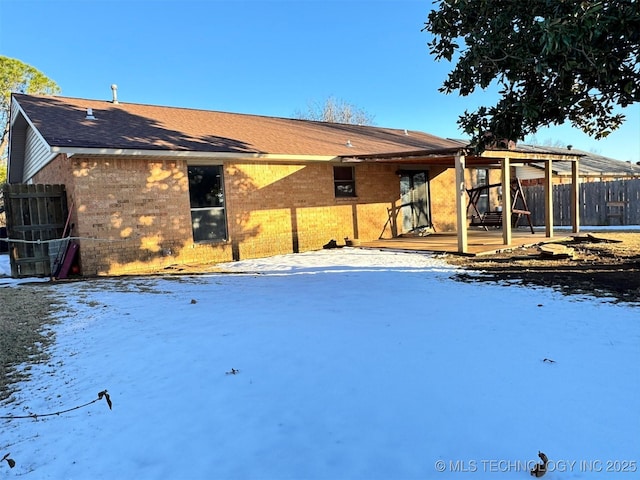 view of snow covered house