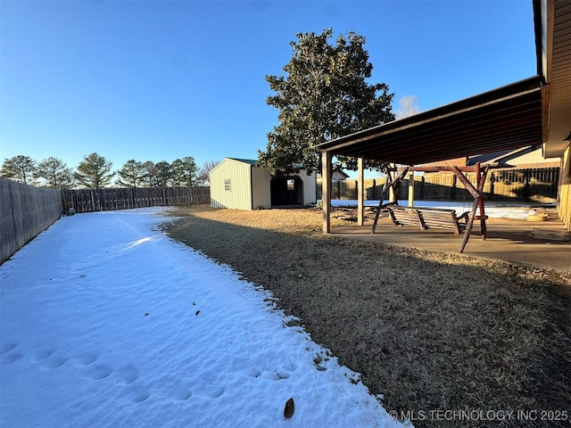 view of yard featuring a storage unit and a patio area