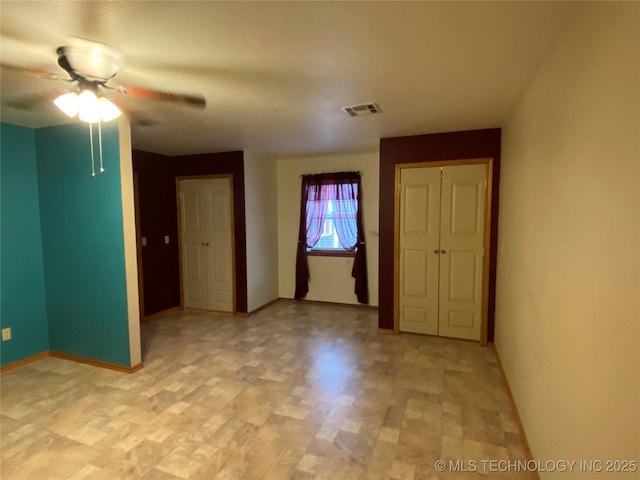 empty room featuring ceiling fan