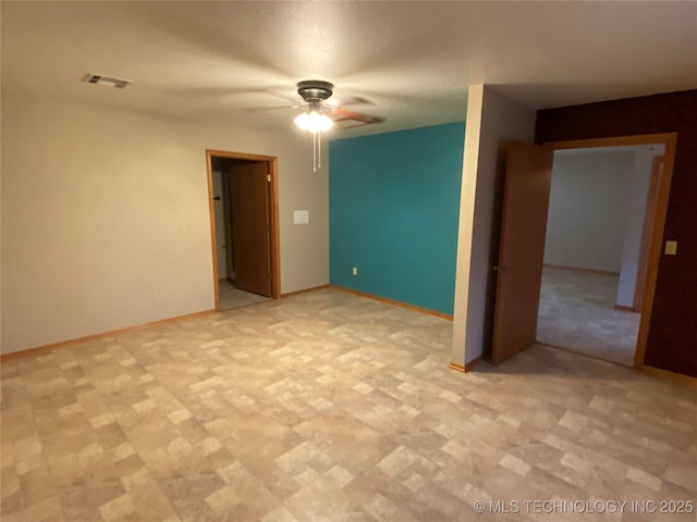 spare room featuring ceiling fan