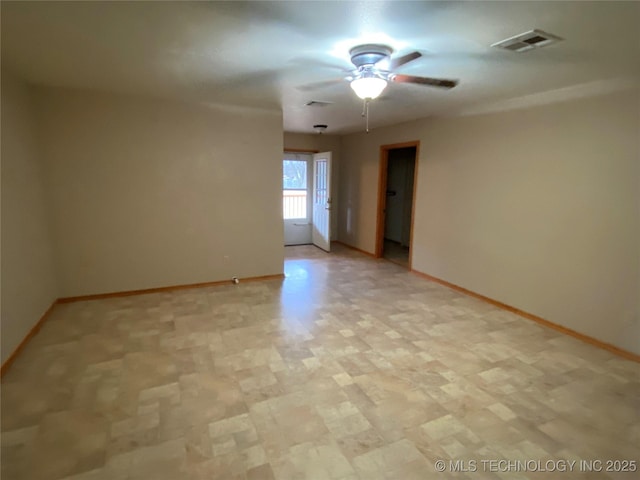 empty room featuring ceiling fan