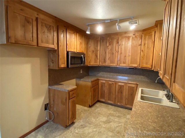 kitchen with tasteful backsplash and sink