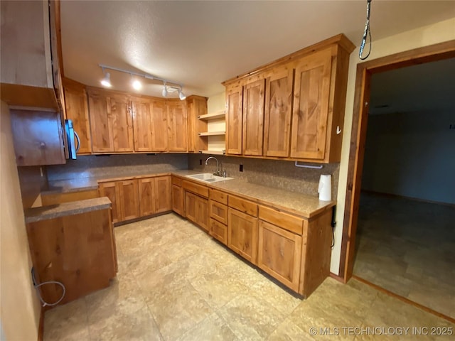 kitchen with tasteful backsplash and sink