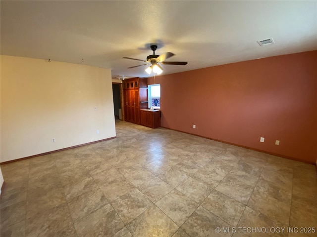 unfurnished room featuring ceiling fan