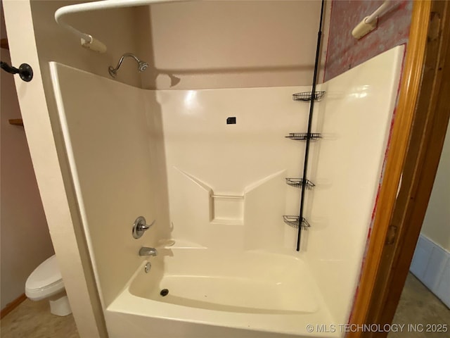 bathroom with tile patterned flooring, shower / bathtub combination, and toilet