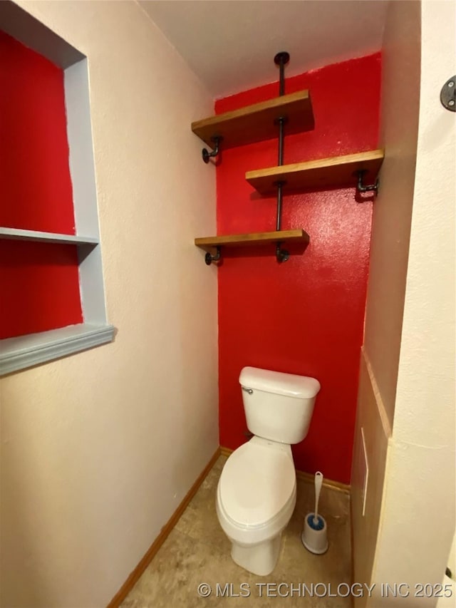 bathroom featuring tile patterned flooring and toilet