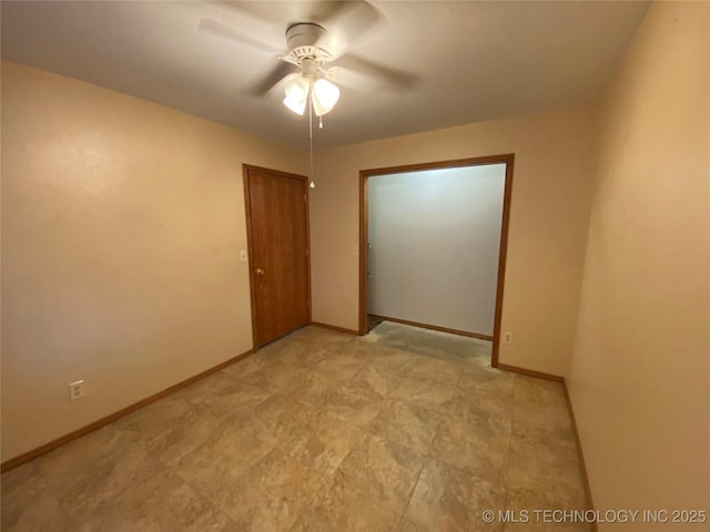 unfurnished room featuring ceiling fan