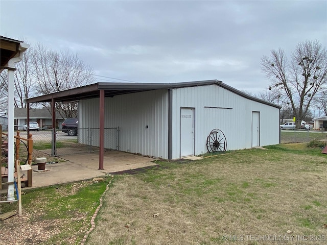 view of outbuilding featuring a yard