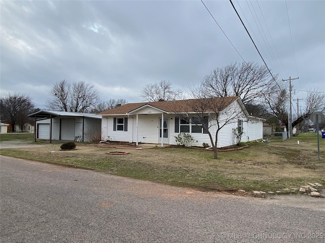 single story home featuring covered porch and a front lawn