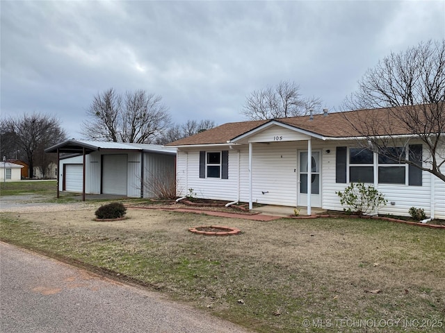 ranch-style home with a porch, a front yard, and a garage