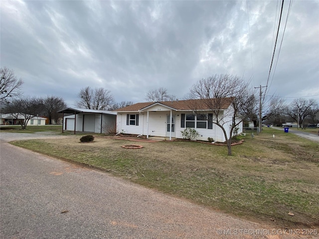 view of front of house with a porch, a garage, and a front yard