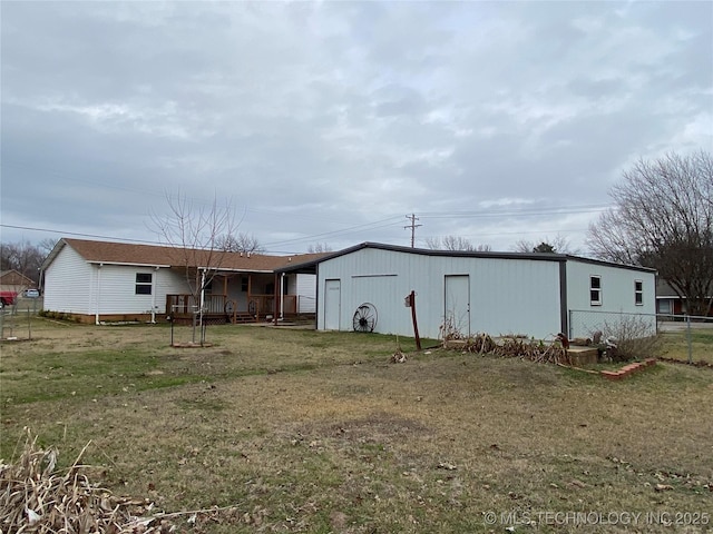 rear view of house with a yard