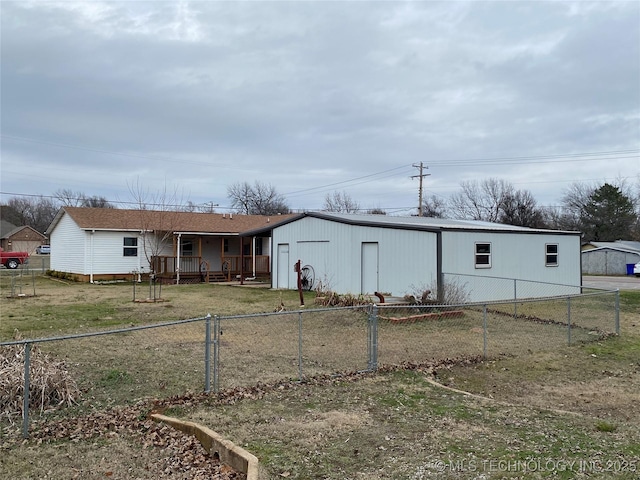 back of property featuring a yard