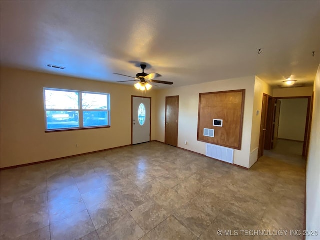 entrance foyer featuring ceiling fan