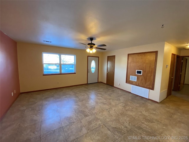 interior space featuring ceiling fan