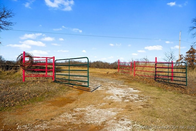 view of gate featuring a rural view