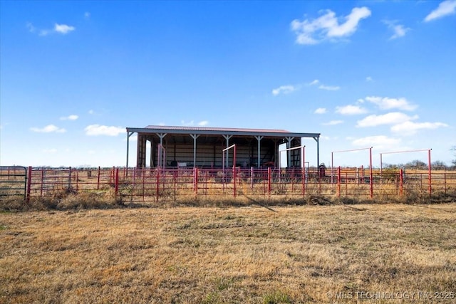 exterior space with a rural view and an outbuilding