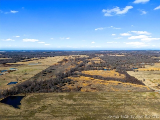 birds eye view of property with a rural view