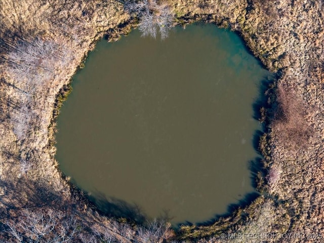 drone / aerial view with a water view