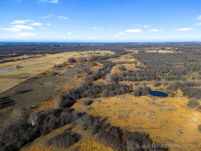 birds eye view of property with a rural view