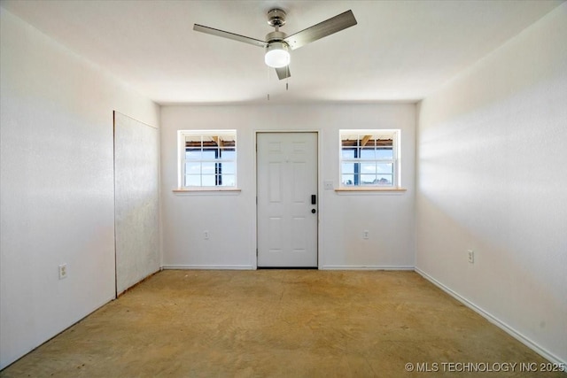 interior space featuring ceiling fan