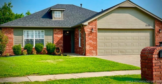 view of front facade with a garage and a front lawn