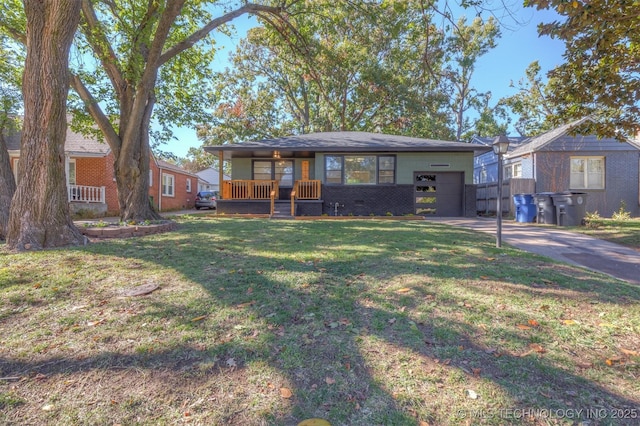 view of front of property with a front yard, a porch, and a garage