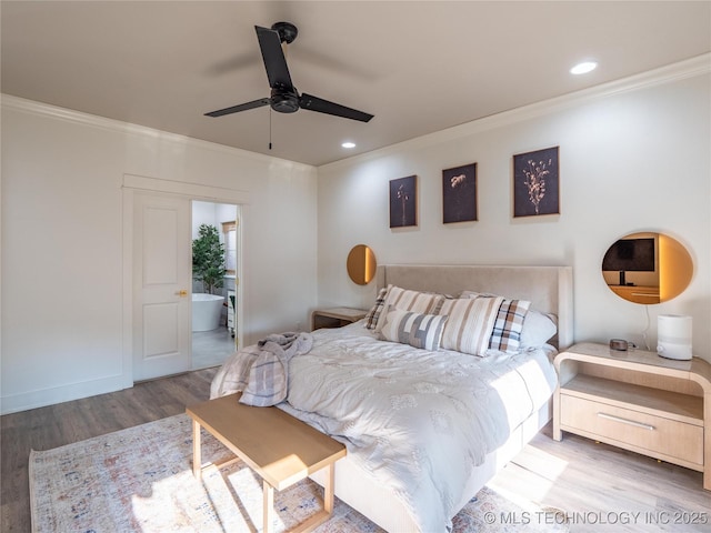 bedroom with ceiling fan, light hardwood / wood-style floors, ornamental molding, and connected bathroom