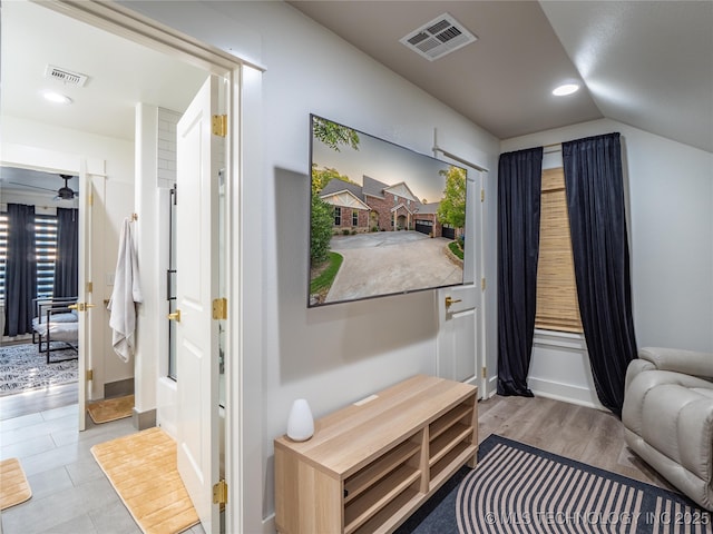 sitting room featuring ceiling fan and lofted ceiling