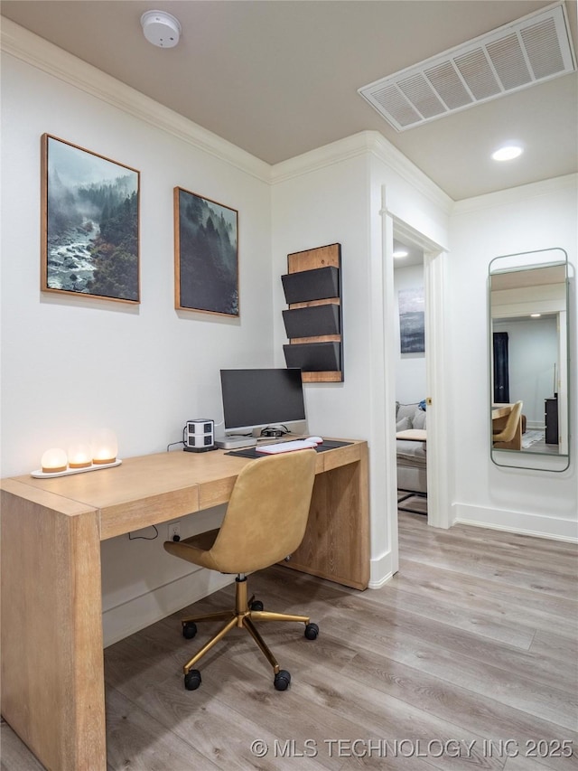 office area featuring light hardwood / wood-style floors and ornamental molding