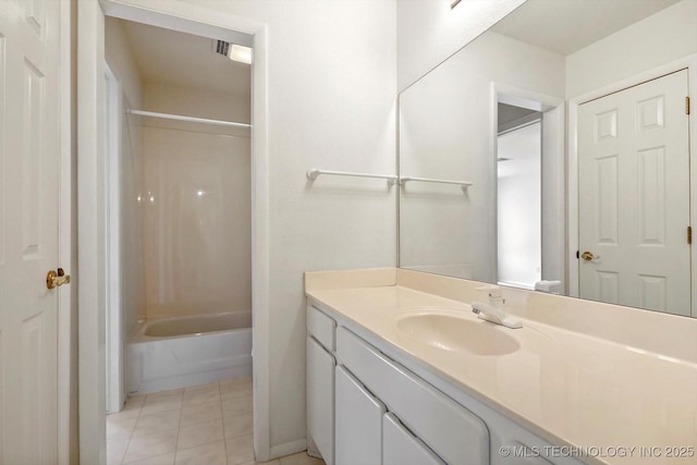 bathroom with tub / shower combination, tile patterned floors, and vanity