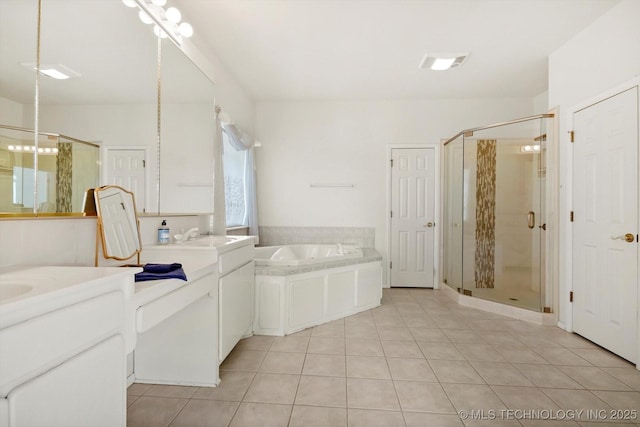 bathroom featuring tile patterned floors, vanity, and independent shower and bath