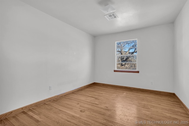 spare room featuring light hardwood / wood-style flooring