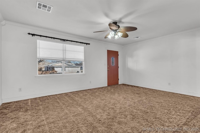 carpeted empty room featuring ornamental molding and ceiling fan