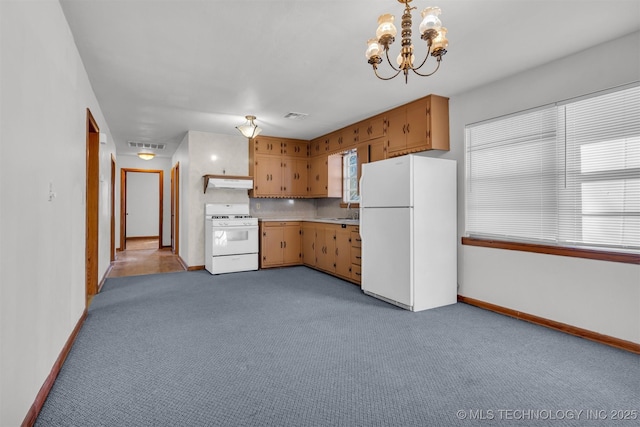 kitchen with sink, white appliances, hanging light fixtures, tasteful backsplash, and light colored carpet