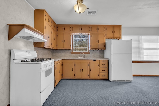 kitchen with sink, white appliances, and backsplash